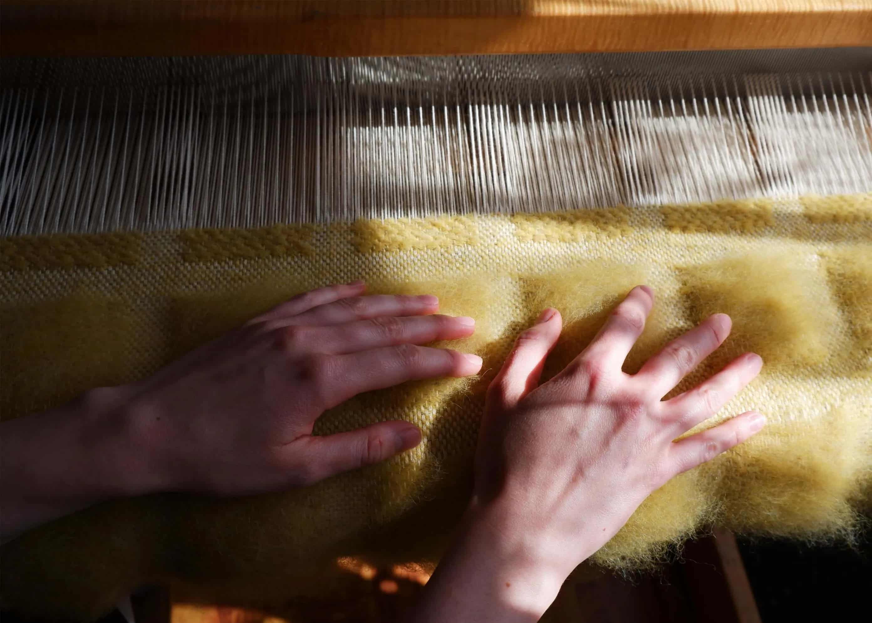 hands on the blur blanket in the process of making